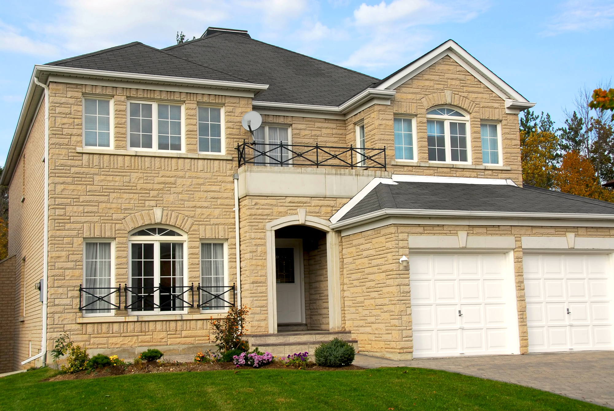 House New detached single family luxury home with stone facade and double garage