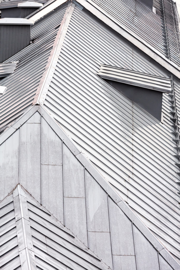 top view on grey metal roof of the old city houses