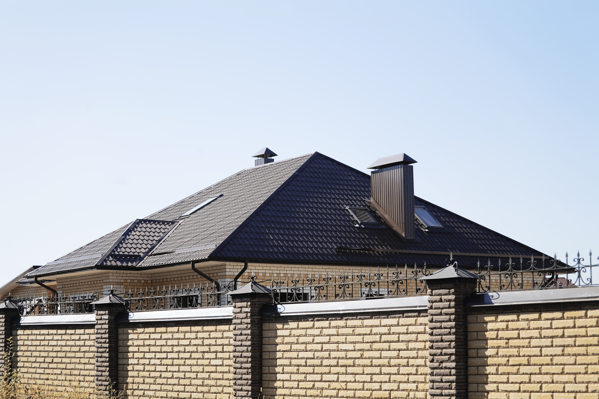 Roof and pipe of a modern apartment house in suburban settlement Roof and pipe of a modern apartment house in suburban settlement